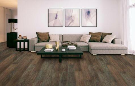 Modern living room with 6mm vinyl plank installed in the colour Amber Shade by Mohawk SolidTech sold by Advanced Flooring in Kitchener-Waterloo.