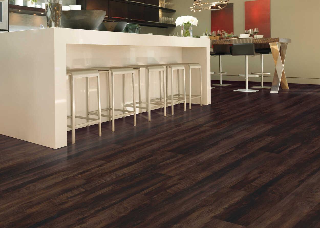 Modern kitchen with Cafe Doppio from Mohawk SolidTech Explorer's Cove luxury vinyl plank 5mm installed.