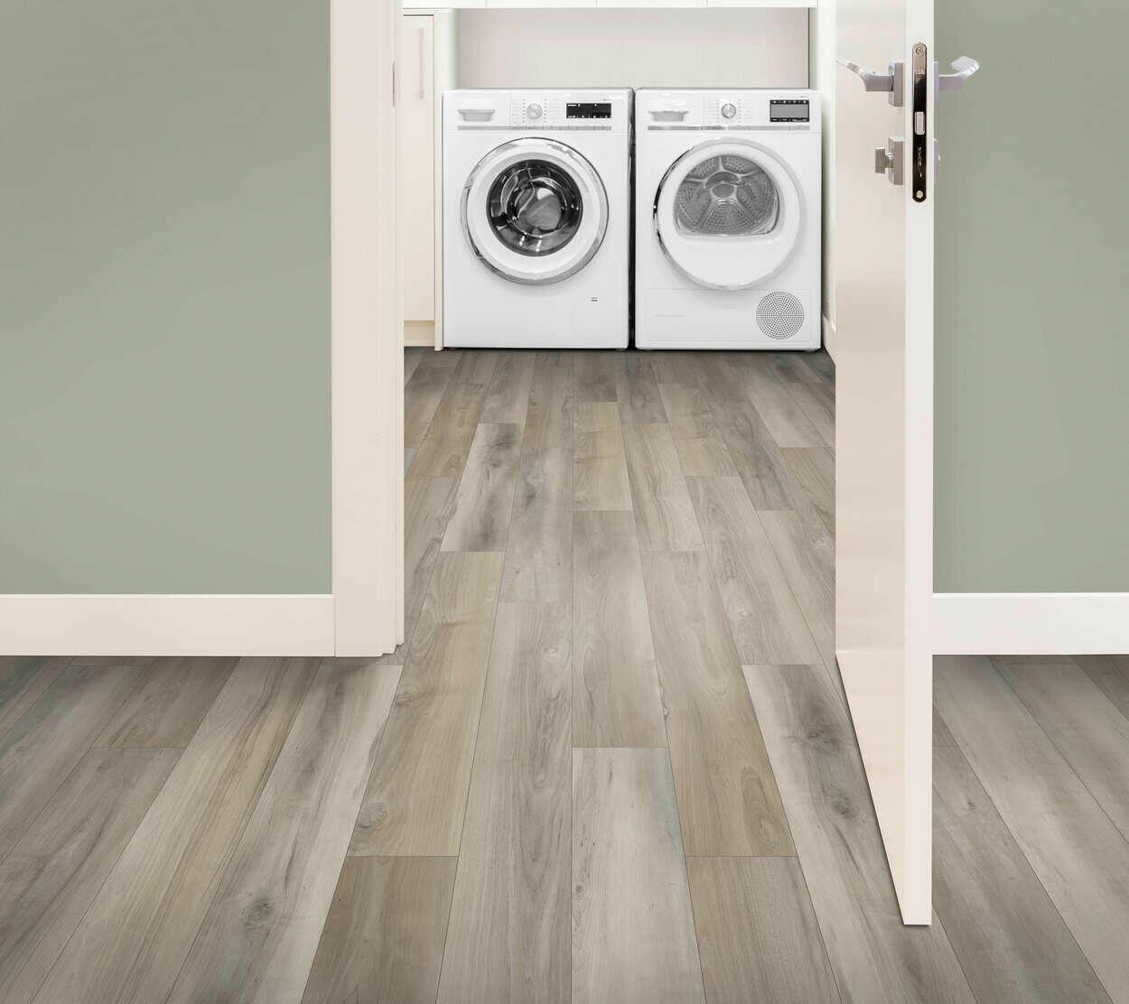 Room with 6mm vinyl plank installed in the colour Cathedral Grey by Mohawk SolidTech sold by Advanced Flooring in Kitchener-Waterloo.