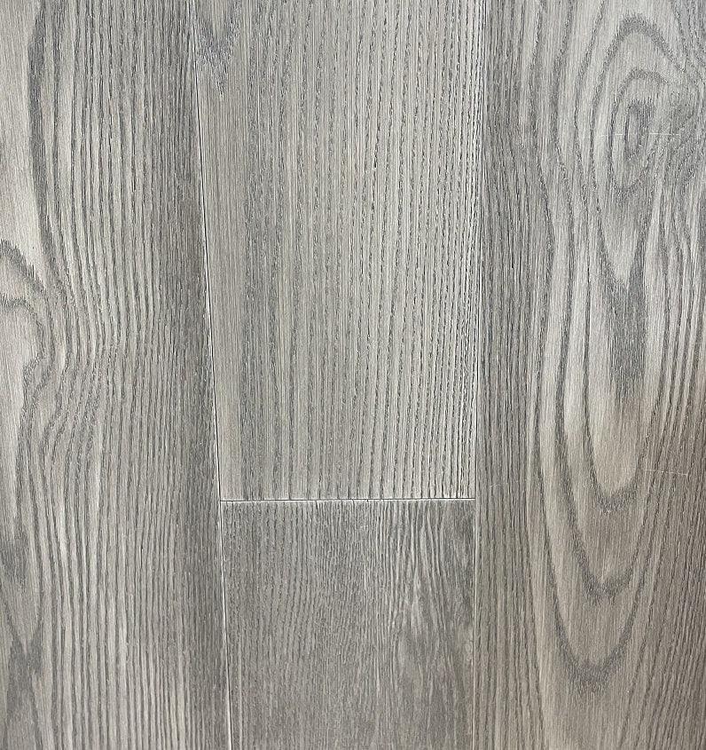 Close-up of CHATEAU AR1305 - Green Touch 7"*3/4" American Oak engineered hardwood flooring sample. Available at Advanced Flooring Waterloo. 