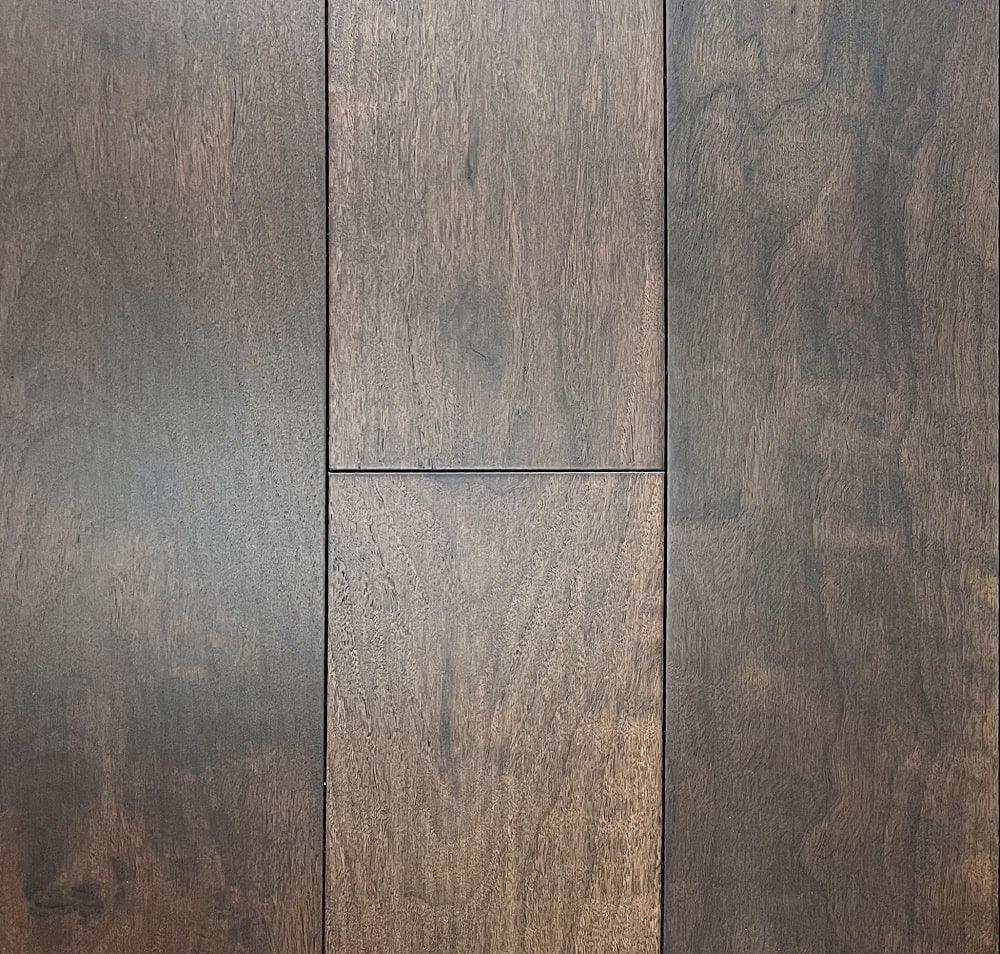 A close up of Chocolate 10 1/4" x 3/4" Smooth VIDAR premium American Black Walnut engineered hardwood flooring