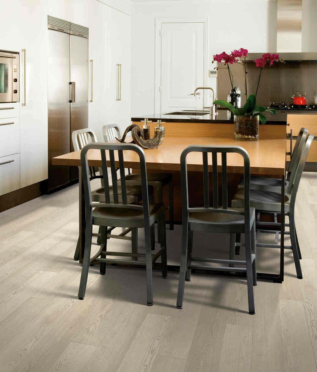 Modern kitchen with 6mm vinyl plank installed in the colour Dash Of Pepper by Mohawk SolidTech sold by Advanced Flooring in Kitchener-Waterloo.