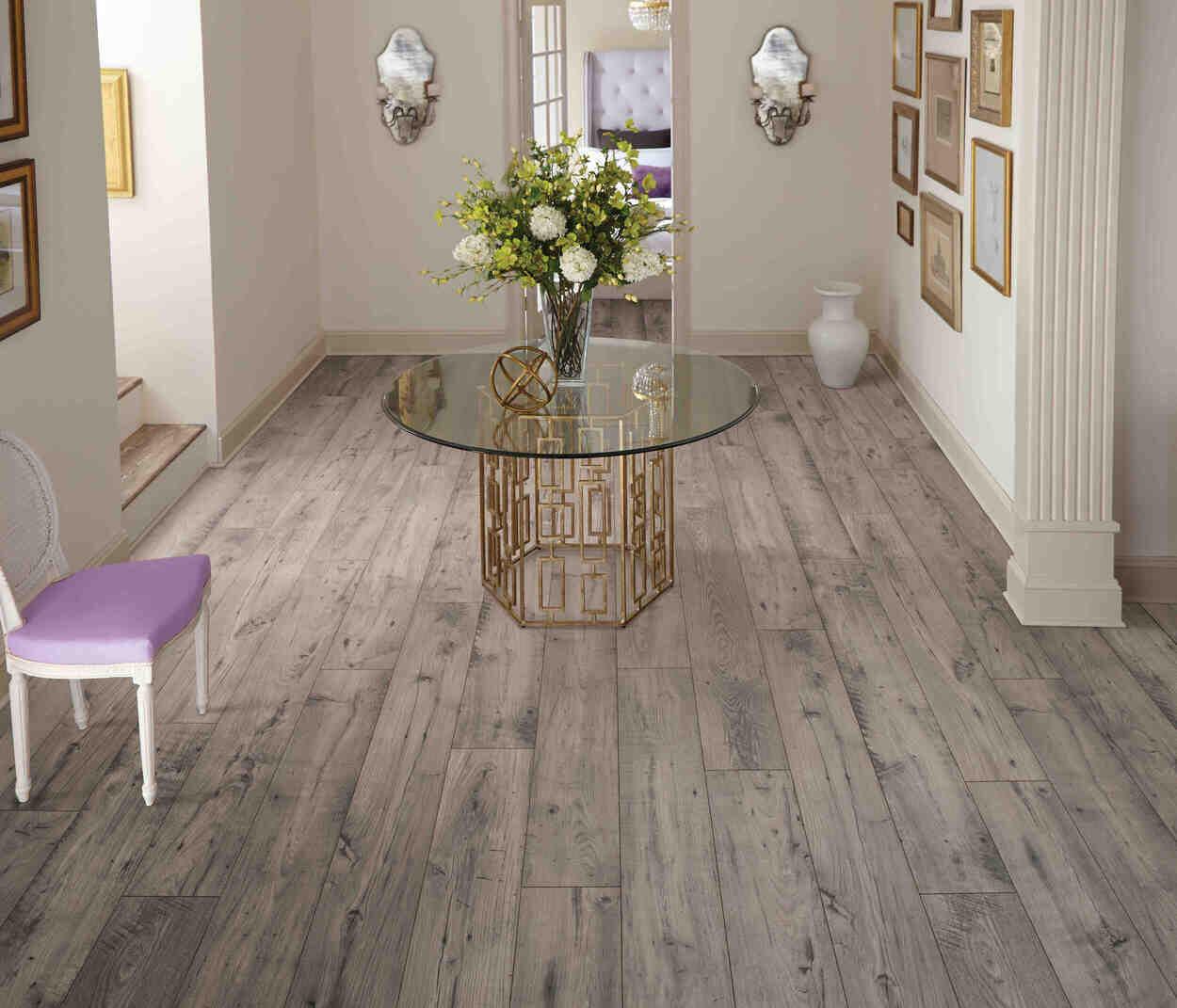 Modern living room with Doeskin Chestnut waterproof laminate flooring by Mohawk RevWood Select RARE VINTAGE installed.