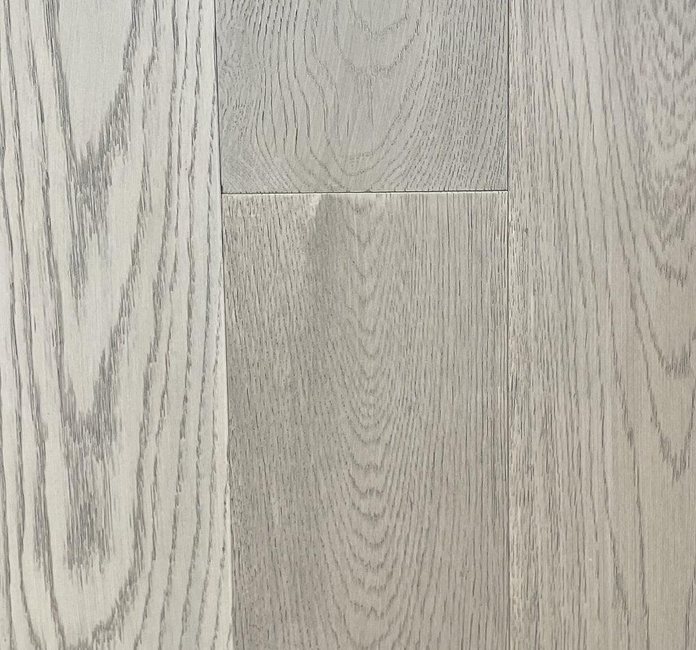 A close-up of Highland Silver European Oak 6.5" Engineered Hardwood from Riche.
