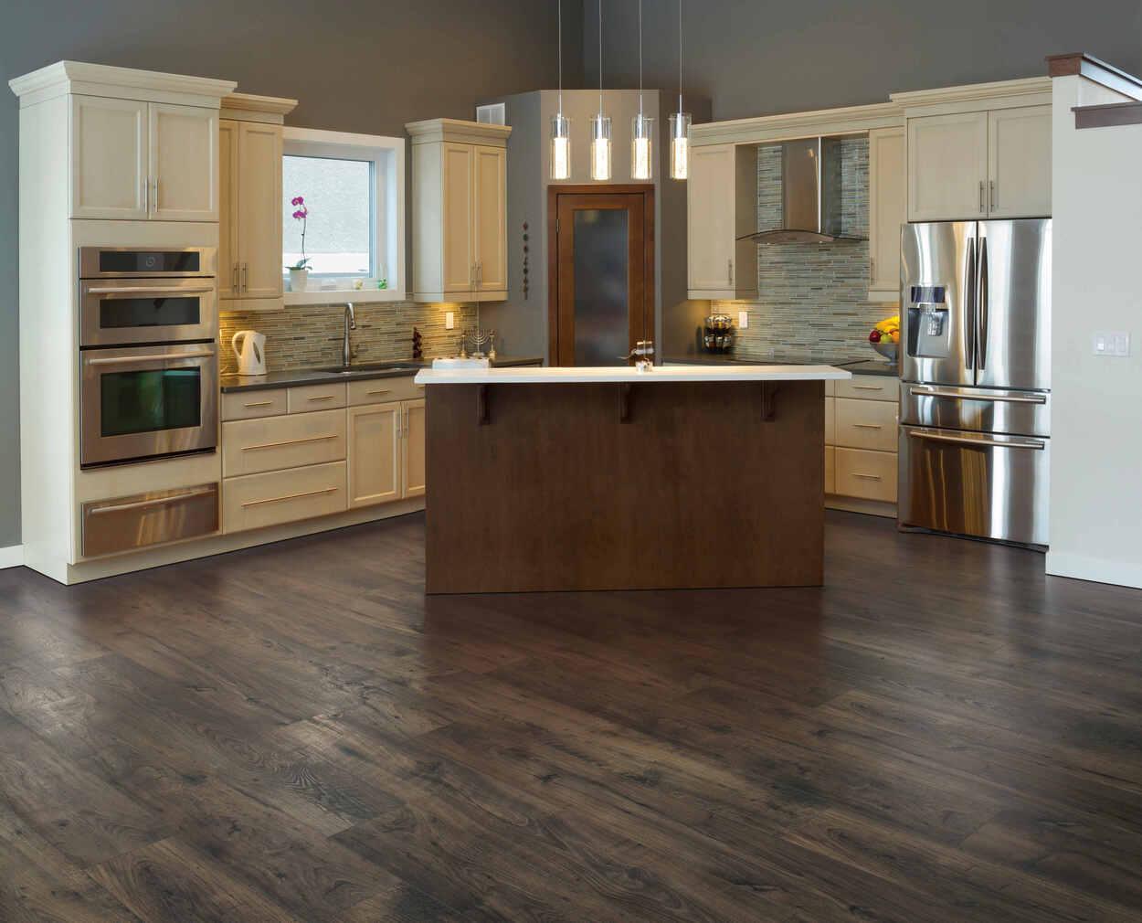 Rustic modern kitchen with Knotted Chestnut waterproof laminate flooring by Mohawk RevWood Select RARE VINTAGE installed.