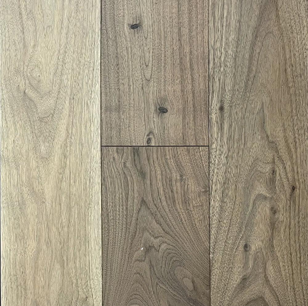 A close up of Naked Walnut 6" x 3/4" Wire Brushed VIDAR premium American Black Walnut engineered hardwood flooring