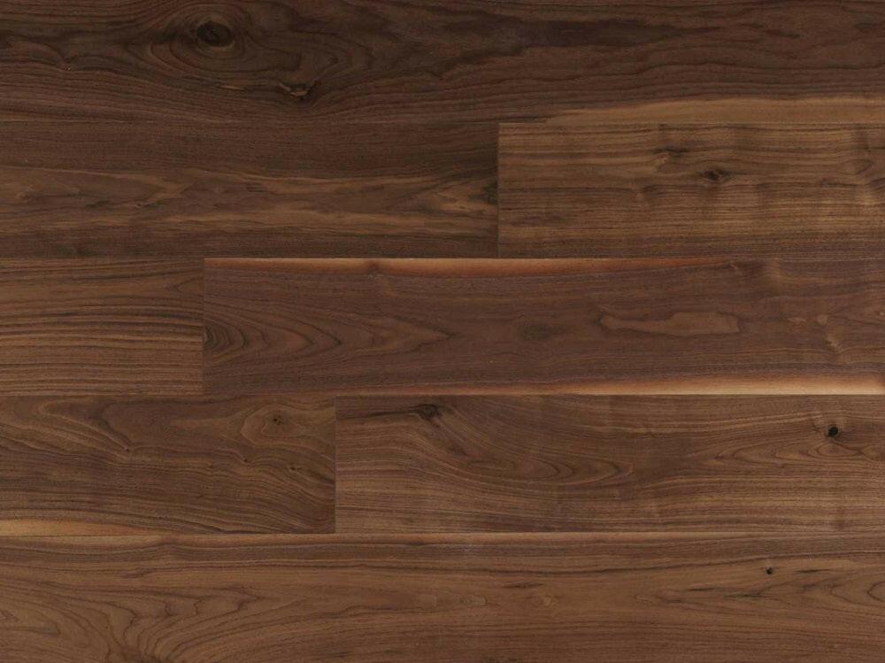 A close up of Natural 7" x 3/4" Smooth VIDAR premium American Black Walnut engineered hardwood flooring