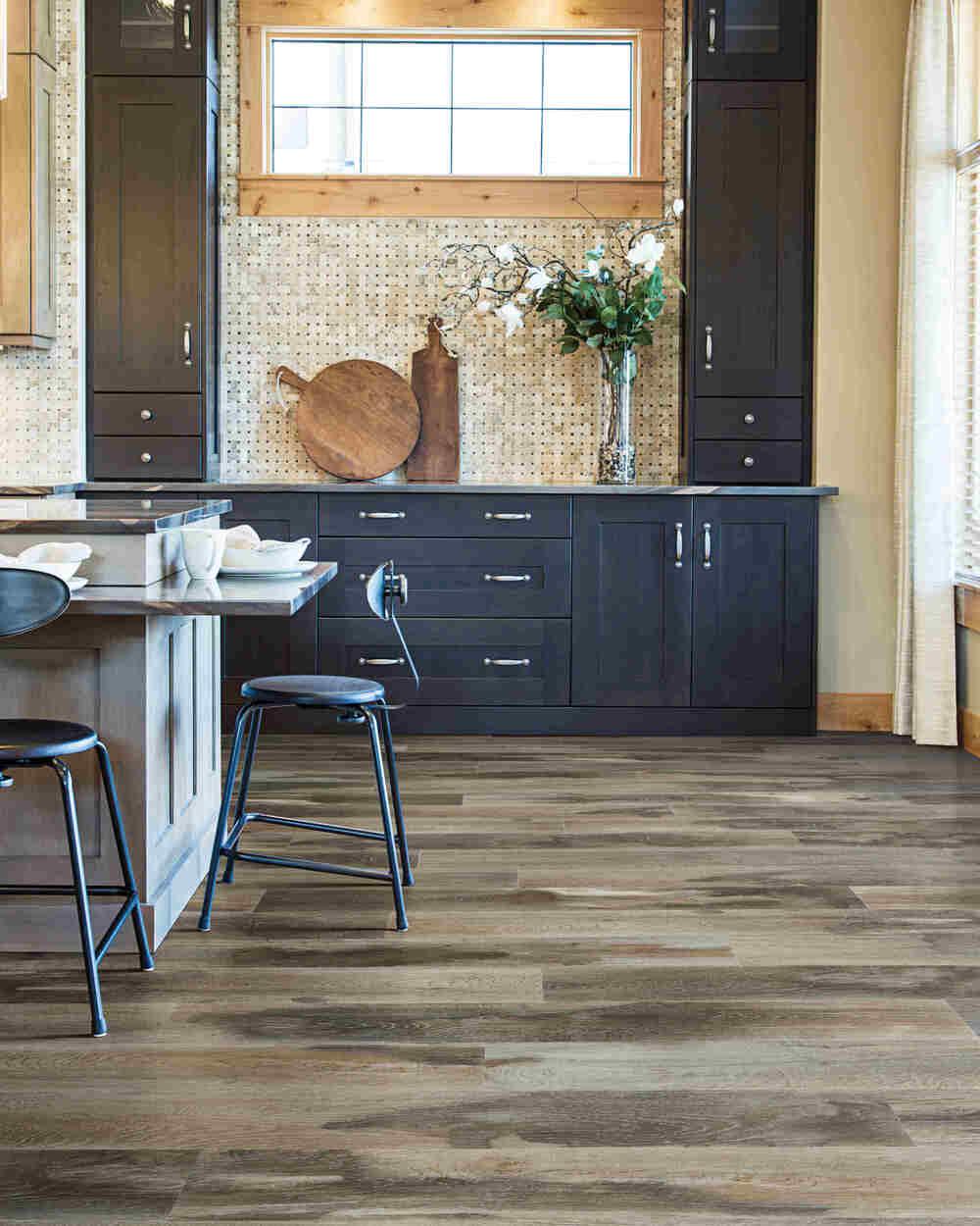 Modern kitchen with Raccoon from Mohawk SolidTech Explorer's Cove luxury vinyl plank 5mm installed.