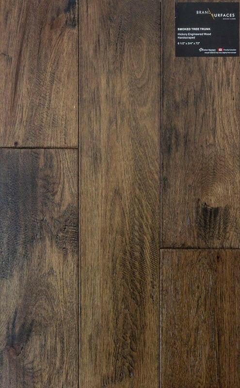 A close up of Smoked Tree Trunk BRAND SURFACES premium 6-½” engineered hardwood flooring from Canadian Standard.