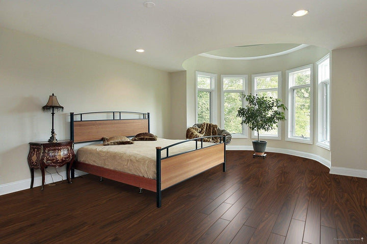 A modern bedroom which displays the beautiful look of TF1119-F Toucan 12mm laminate flooring.
