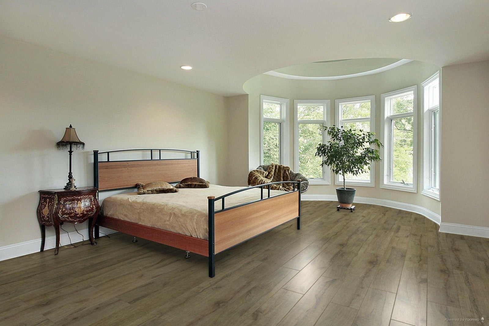 A modern bedroom which displays the beautiful look of TF6010 Toucan 12mm laminate flooring.