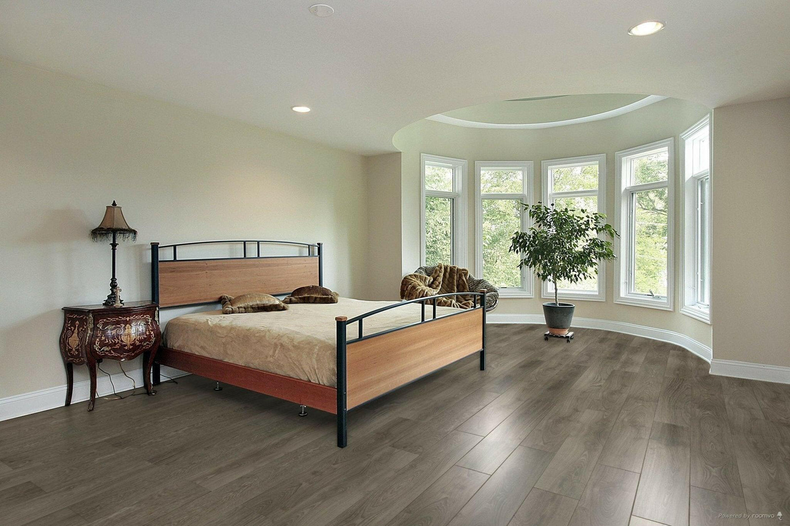 A modern bedroom which displays the beautiful look of TF6021-F Toucan 12mm laminate flooring.