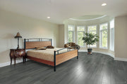 A modern bedroom which displays the beautiful look of TF6310-F Toucan 12mm laminate flooring.