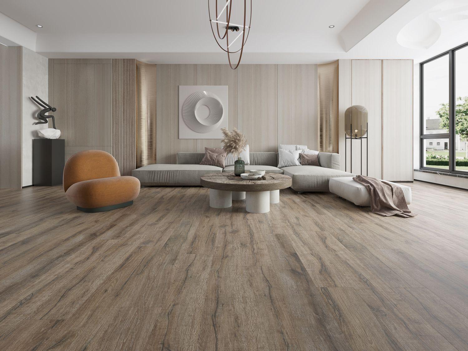 A bright and inviting living room showcasing the rich, brown tones of Purelux laminate flooring.