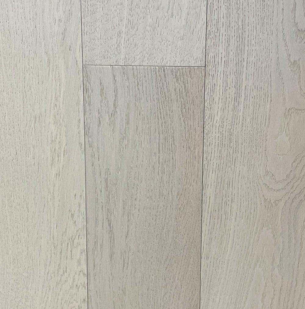 A close-up of 6105 White Sand European Oak Engineered Hardwood from Riche.