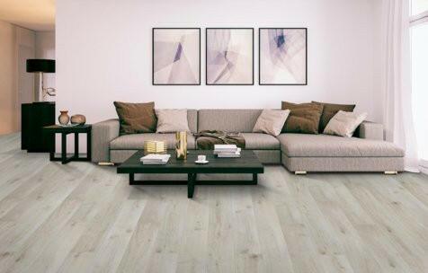 modern chic living room with Whitewash Oak Mohawk RevWood Plus Bellente waterproof laminate flooring installed