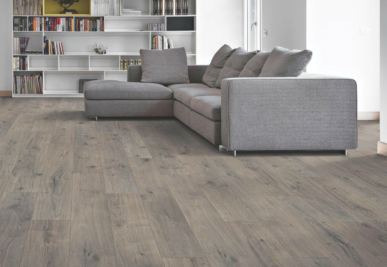Modern room with Waterproof Laminate installed in the colour Wickham Gray Oak by Mohawk RevWood sold by Advanced Flooring in Kitchener-Waterloo.